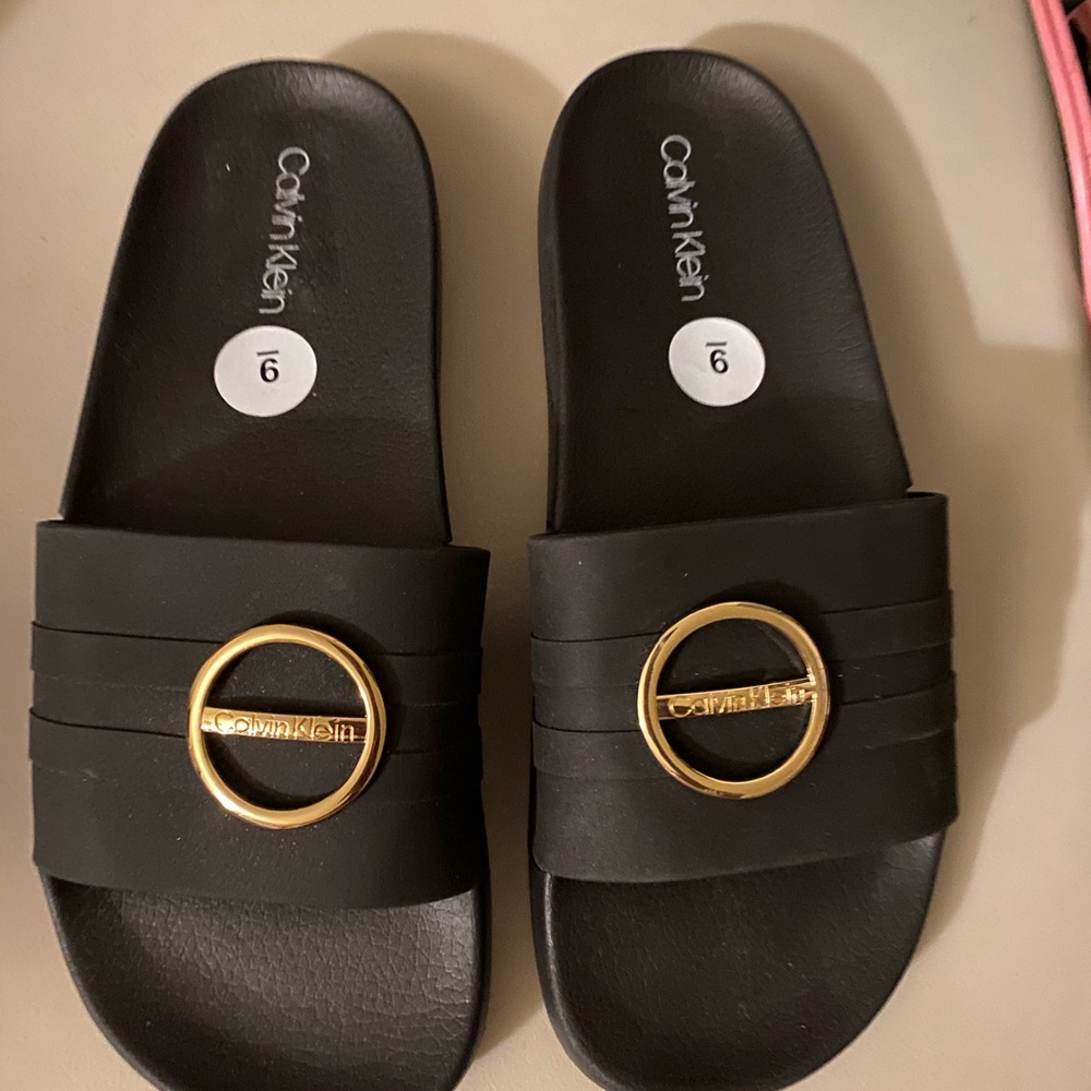 Calvin Klein Black and Gold Sandals with Modern Design